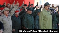 Venezuela's President Nicolas Maduro attends a military parade with the National Bolivarian Militia in Caracas, Venezuela, Dec. 17, 2018.