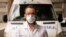 Doctor Sebastian Yancev stands in front of the ambulance used to move some patients to hospitals in Montevideo, Uruguay, from an Australian cruise ship stricken with a coronavirus outbreak.