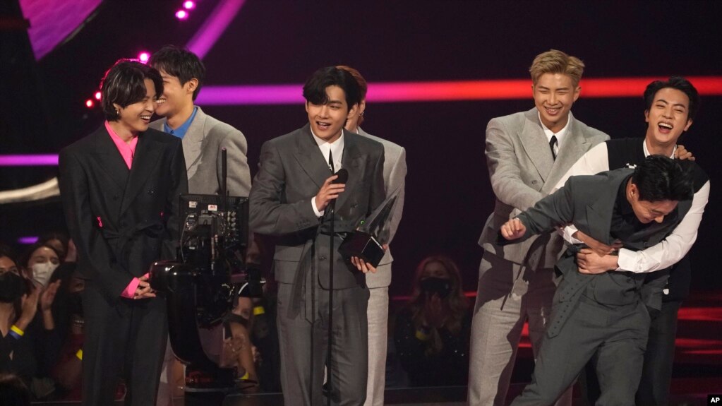 BTS accepts the award for artist of the year at the American Music Awards on Sunday, Nov. 21, 2021 at Microsoft Theater in Los Angeles. (AP Photo/Chris Pizzello)