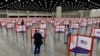 FILE - Voting stations are seen in the South Wing of the Kentucky Exposition Center in Louisville, Kentucky, June 23, 2020.