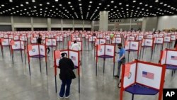 FILE - Voting stations are seen in the South Wing of the Kentucky Exposition Center in Louisville, Kentucky, June 23, 2020.