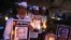 FILE - Supporters of India’s Aam Aadmi Party (AAP), or Common Man's Party, hold portraits of scholar Malleshappa M. Kalburgi during a candlelight vigil Tuesday in Bangalore to protest his weekend killing.