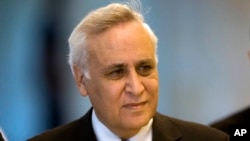 FILE - In this Nov. 10, 2011 file photo, Former Israeli President Moshe Katsav arrives at the Supreme court, in Jerusalem. His request for a conditional early release from prison has been rejected by a parole board.