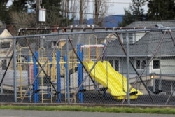 A playground at Lowell Elementary School in Tacoma, Washington sits empty after school closed because of the coronavirus. Parents are deciding how to talk with their children about the virus.