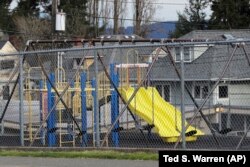 A playground at Lowell Elementary School in Tacoma, Washington sits empty after school closed because of the coronavirus. Parents are deciding how to talk with their children about the virus.