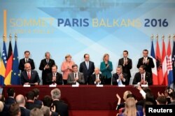 FILE - Leaders from the European Union and Balkan states meet during a western Balkans summit in Paris, July 4, 2016.
