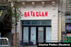 FILE - The new facade of the Bataclan concert hall is seen after months of renovations at the site almost one year after a series of attacks at several sites in Paris, France, France, Oct. 27, 2016.