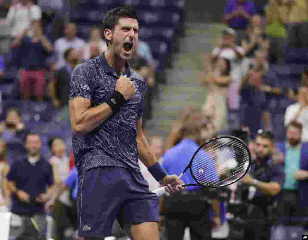 Novak Djokovic of Serbia, celebrates after defeating John Millman of Australia, 6-3, 6-4, 6-4, in the quarterfinals of the U.S. Open tennis tournament in New York, Sept. 5, 2018.