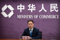 Gao Feng, spokesman for China's Ministry of Commerce, speaks during a late-night press conference about a China-Europe investment deal at the Ministry of Commerce in Beijing, Wednesday, Dec. 30, 2020. European Union top officials and Chinese…