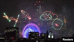 Fireworks light up the sky around the London Eye wheel to welcome the New Year in London, Britain, Jan. 1, 2019. 