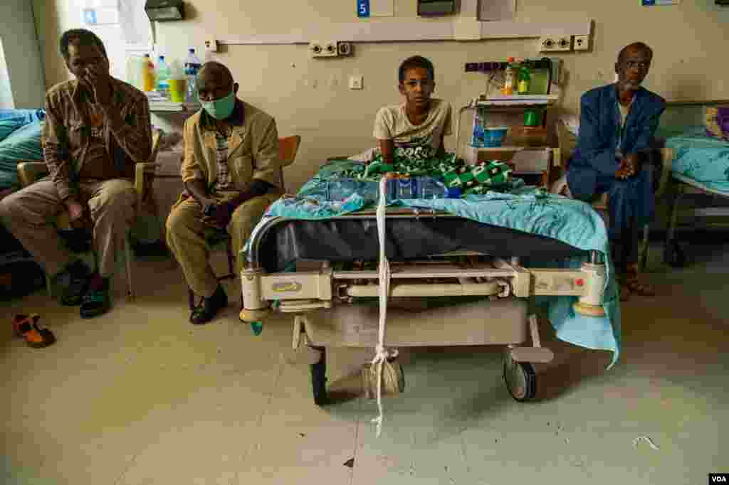 A wounded boy sits on a bed in the Ayder Referral Hospital on June 4, 2021, in Mekelle, Ethiopia.
