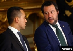 FILE - Interior Minister Matteo Salvini talks with Italy's Minister of Labor and Industry Luigi Di Maio at the Quirinal palace in Rome, Italy, June 1, 2018.