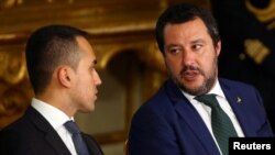 FILE - Interior Minister Matteo Salvini talks with Italy's Minister of Labor and Industry Luigi Di Maio at the Quirinal palace in Rome, Italy, June 1, 2018. 