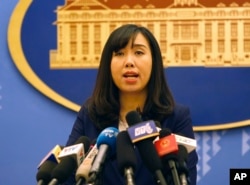 FILE - Vietnamese Foreign Ministry spokeswoman Le Thi Thu Hang speaks to reporters during a regular press briefing in Hanoi, Vietnam, Aug. 3, 2017.