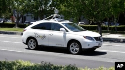 FILE - A Google self-driving car goes on a test drive near the Computer History Museum in Mountain View, Calif, May 14, 2014. A California police officer made a traffic stop, but wrote no ticket. There was no driver to give it to anyway.