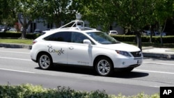 FILE - A Google self-driving car goes on a test drive near the Computer History Museum in Mountain View, Calif, May 14, 2014.