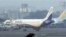 FILE - An IndiGo aircraft stands parked at Chhatrapati Shivaji airport in Mumbai, India, January 12, 2011.