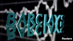 FILE - The Barclays logo is seen in front of displayed stock graph in this illustration taken June 21, 2017. 