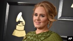 Adele arrives at the 59th annual Grammy Awards at the Staples Center, Feb. 12, 2017, in Los Angeles. 