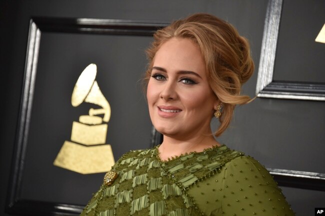 FILE - Adele arrives at the 59th annual Grammy Awards at the Staples Center on Feb. 12, 2017, in Los Angeles.