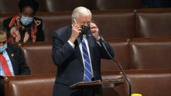 FILE - In this image from video, Rep. Steny Hoyer, D-Md., takes his face covering off as he speaks on the floor of the House of Representatives at the U.S. Capitol in Washington, April 23, 2020. (House Television via AP)