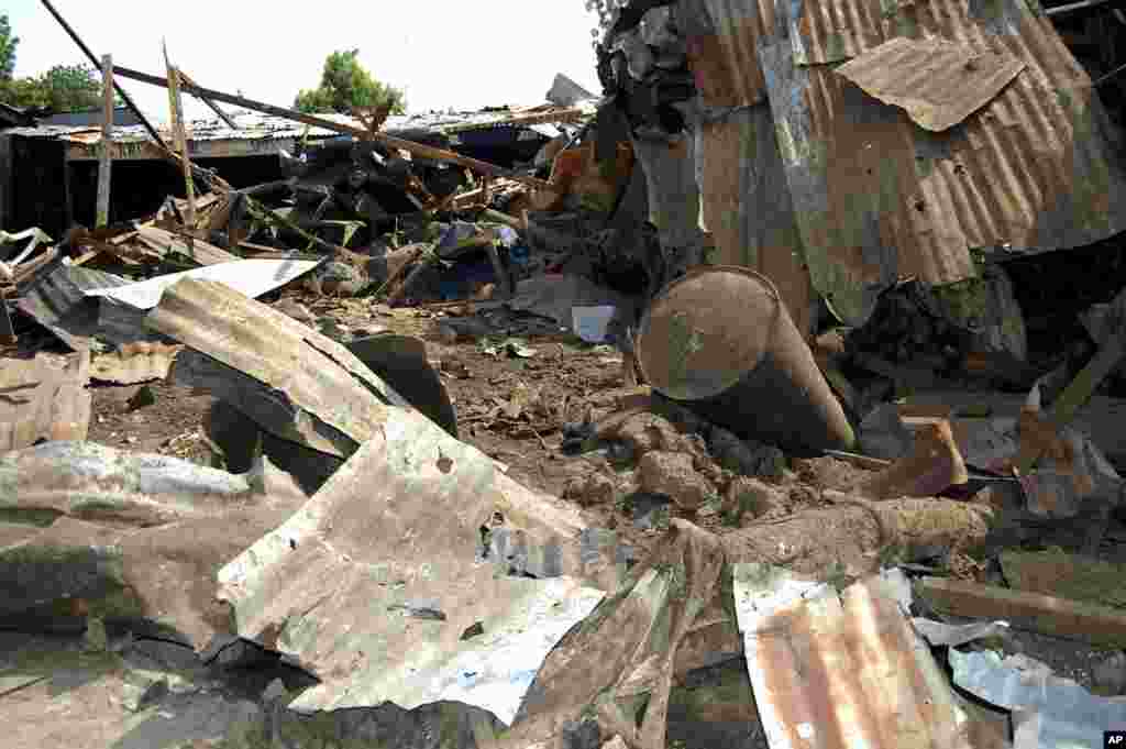 Shattered remnants are seen at the site of a bomb blast at a bar in the Nigerian northeastern city of Maiduguri July 3, 2011. An explosion killed at least five people and injured 10 more on Sunday at a bar near a police barracks in Nigeria's northeastern 