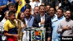 Venezuelan opposition leader Juan Guaido sings the national anthem during a rally held by his supporters against Venezuelan President Nicolas Maduro's government, in Caracas, Venezuela March 4, 2019. (REUTERS/Carlos Garcia Rawlins)