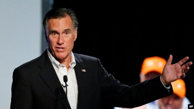Former Republican presidential nominee Mitt Romney introduces Republican U.S. Rep. Mia Love, of Utah, during a campaign rally, Aug. 24, 2018, in Lehi, Utah.