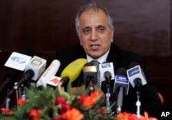 In this March 13, 2009, file photo, Zalmay Khalilzad, special adviser on reconciliation speaks during a news conference in Kabul, Afghanistan.