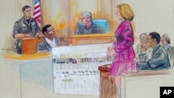 FILE - This artist rendering shows Maryland State Attorney Katherine Winfree showing convicted sniper Lee Boyd Malvo (seated left) and John Allen Muhammad (right) a chart of the victims of the 2002 Washington-area sniper shootings during a courtroom hearing, May, 23, 2006, at the Montgomery County Courthouse in Rockville, Md.
