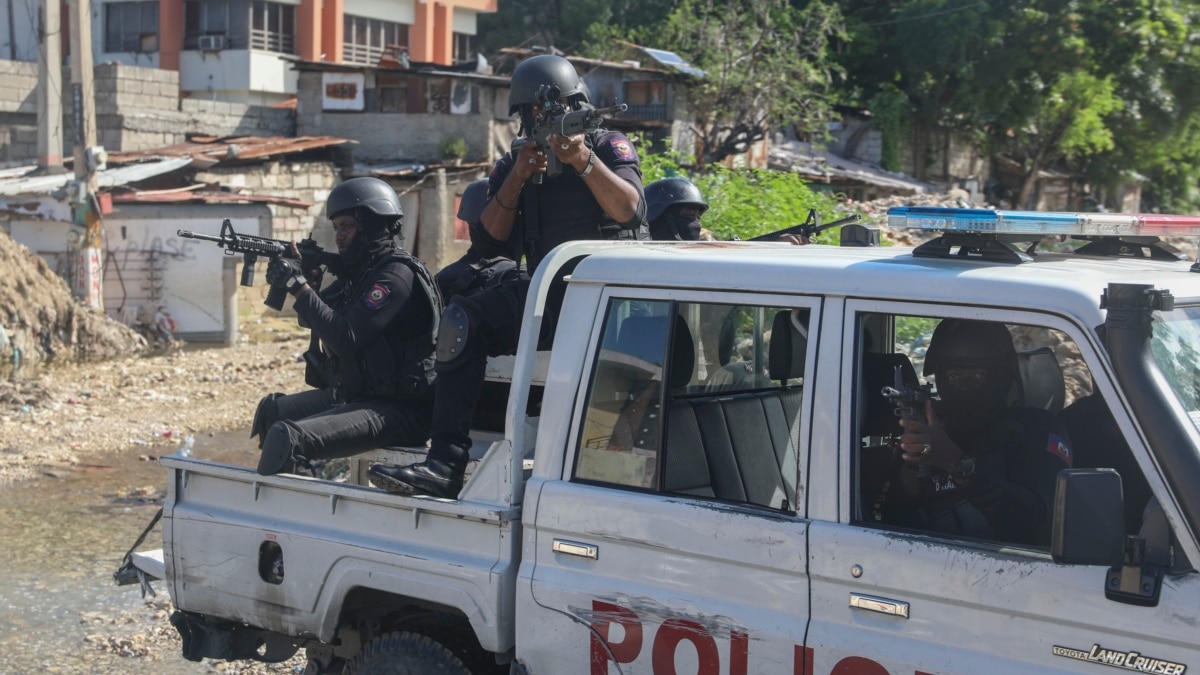 Haiti swears in new PM as gangs shoot at flight landing at airport