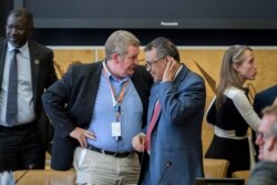 World Health Organization director-general Tedros Adhanom Ghebreyesus, right, listens to WHO emergencies chief Mike Ryan during a meeting of the United Nations.