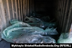 The bodies of 12 dead Russian soldiers in a refrigerator car at the Voznesensk railway station in Voznesensk, Ukraine, March 16, 2022