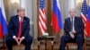 FILE - U.S. President Donald Trump, left, and Russian President Vladimir Putin, right, listen to the media in Helsinki, Finland, July 16, 2018. Trump said on Tuesday he would likely impose sanctions on Russia if Putin refuses to negotiate about ending the war in Ukraine. 