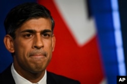 FILE - Britain's Prime Minister Rishi Sunak delivers a speech during a press conference on the net zero target, at the Downing Street Briefing Room, in central London, Wednesday Sept. 20, 2023. He says the UK must fight climate change without penalizing workers and consumers.