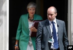 Britain's Prime Minister Theresa May leaves 10 Downing Street for her weekly Prime Minister's Questions at the House of Commons in London, July 10, 2019.