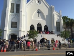 People gather ahead of worship services at the Emanuel AME Church in Charleston, South Carolina, June 21, 2015. (Jerome Socolovsky/VOA)