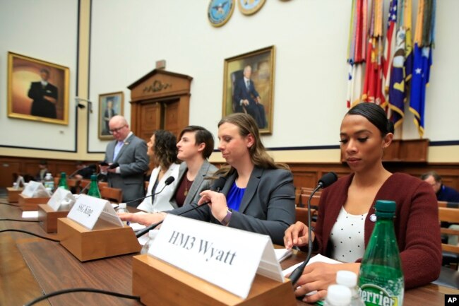 From left, transgender military members Navy Lt. Cmdr. Blake Dremann, Army Capt. Alivia Stehlik, Army Capt. Jennifer Peace, Army Staff Sgt. Patricia King and Navy Petty Officer Third Class Akira Wyatt prepare for the House Armed Services subcommittee on military personnel hearing on Capitol Hill in Washington, Feb. 27, 2019.