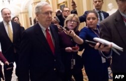 FILE - U.S. Senate Majority Leader Mitch McConnell leaves the U.S. Capitol as he goes to the White House, Dec. 21, 2018.