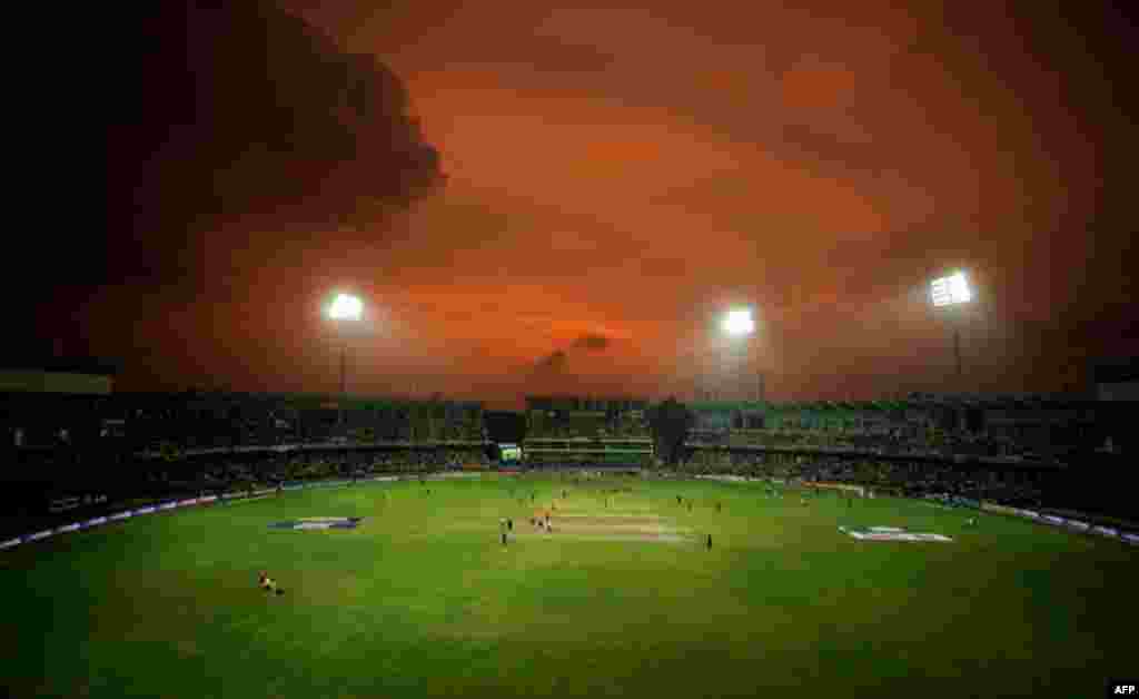 March 29: The sun sets as Sri Lanka and New Zealand play their ICC Cricket World Cup 2011 semi-final match in Colombo. (Reuters/Philip Brown)