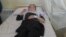 A student from Bibi Hajira school in Taloqan City is treated Takhar Province, Afghanistan, May 23, 2012. (Sayed Kabir Sayar/VOA)
