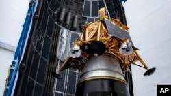 This photo provided by SpaceX in January 2025 shows the Firefly Aerospace Blue Ghost lunar lander being placed in a rocket fairing. (SpaceX via AP)