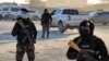 Members of the Syrian Democratic Forces (SDF) deploy around Ghwayran prison in Syria's northeastern city of Hasakeh on January 25, 2022. (AFP)