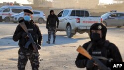 Members of the Syrian Democratic Forces (SDF) deploy around Ghwayran prison in Syria's northeastern city of Hasakeh on January 25, 2022. (AFP)