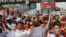 Garment workers block a road demanding their due wages during the lockdown amid concerns over the coronavirus disease (COVID-19) outbreak in Dhaka, Bangladesh, April 13, 2020.
