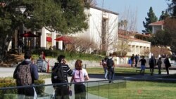 FILE - In this Feb. 2, 2012, photo, students walk through the campus of Claremont McKenna College in Claremont, Calif.
