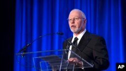 FILE - Paul Singer, founder and CEO of hedge fund Elliott Management Corp., speaks at the Manhattan Institute for Policy Research Alexander Hamilton Award Dinner, in New York, May 12, 2014. The Washington Free Beacon, an online publication backed by Singer, said it was the original funder of the Fusion GPS project to compile opposition research on multiple Republican presidential candidates in the 2016 campaign, including Donald Trump.