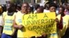 Zimbabwean vendors hold banners urging the government to stop their forced removals from the street during a demonstration in Harare, Wednesday, June, 24, 2015. Hundreds of vendors took to the streets of Harare demonstrating against an impending eviction from the streets.