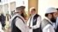 In this photo released by the Foreign Office, Pakistan's Foreign Minister Shah Mehmood Qureshi, center, receives members of Taliban delegation at the Foreign Office in Islamabad, Pakistan, Thursday, Oct. 3, 2019. Senior Taliban leaders are meeting…