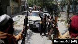 Taliban fighters patrol in Kabul, Afghanistan, Thursday, Aug. 19, 2021. (AP Photo/Rahmat Gul)